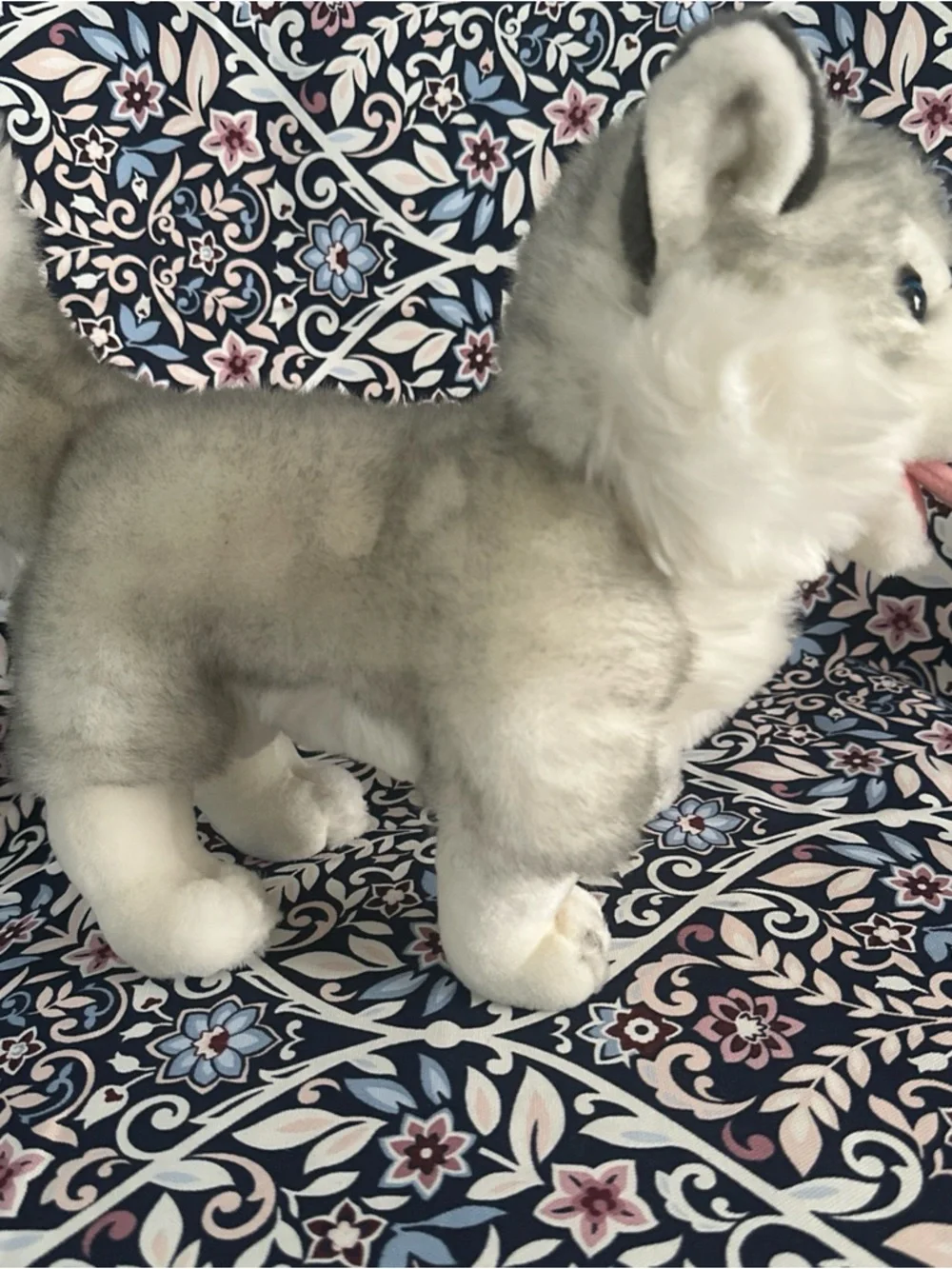 Siberian Husky dog toy with blue eyes and a happy open mouth showing its tongue